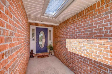 Welcome home to this beautifully updated Gulf Breeze gem, tucked on Tiger Point Golf and Country Club in Florida - for sale on GolfHomes.com, golf home, golf lot