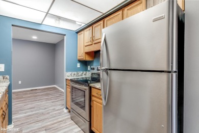 This beautifully maintained two-story condo features two on Plum Brook Golf Club in Michigan - for sale on GolfHomes.com, golf home, golf lot