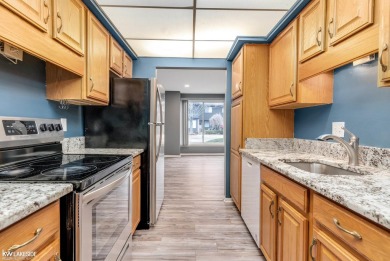 This beautifully maintained two-story condo features two on Plum Brook Golf Club in Michigan - for sale on GolfHomes.com, golf home, golf lot