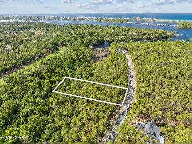 Gorgeous wooded lot located towards the end of a cul-de-sac in on Sharks Tooth Golf Club in Florida - for sale on GolfHomes.com, golf home, golf lot