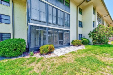 Rarely available, first floor, 3 bedroom, 2 bath corner unit on Largo Golf Course in Florida - for sale on GolfHomes.com, golf home, golf lot