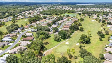 Located on a quiet cul-de-sac with golf course views, this on Eagle Ridge At Spruce Creek Country Club in Florida - for sale on GolfHomes.com, golf home, golf lot