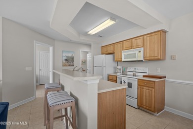 Step into coastal comfort with this spacious, 2-bedroom, 2-bath on Brunswick Plantation and Golf Resorts in North Carolina - for sale on GolfHomes.com, golf home, golf lot