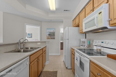 Step into coastal comfort with this spacious, 2-bedroom, 2-bath on Brunswick Plantation and Golf Resorts in North Carolina - for sale on GolfHomes.com, golf home, golf lot