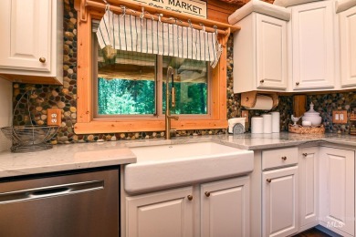 Introducing a one-of-a-kind hand-hewn log cabin nestled in the on Terrace Lakes Golf Resort in Idaho - for sale on GolfHomes.com, golf home, golf lot