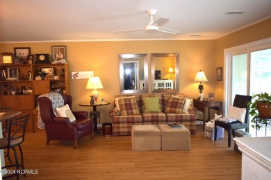 This first-floor end unit is full of coastal charm and natural on Carolina Shores Golf Course in North Carolina - for sale on GolfHomes.com, golf home, golf lot