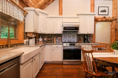 Introducing a one-of-a-kind hand-hewn log cabin nestled in the on Terrace Lakes Golf Resort in Idaho - for sale on GolfHomes.com, golf home, golf lot