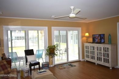 This first-floor end unit is full of coastal charm and natural on Carolina Shores Golf Course in North Carolina - for sale on GolfHomes.com, golf home, golf lot