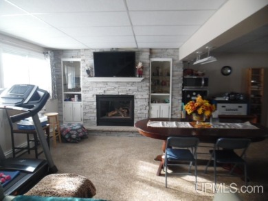 Charming 3-Bedroom, 2-Bath Bi-Level Home on the Golf Course! on Escanaba Country Club in Michigan - for sale on GolfHomes.com, golf home, golf lot