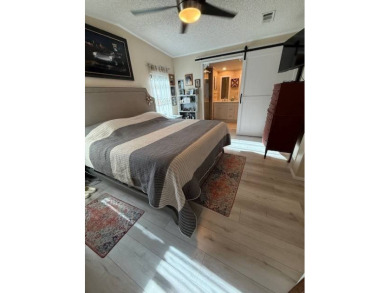 Imagine every day having coffee or lunch on your private deck on Hamptons Golf Club in Florida - for sale on GolfHomes.com, golf home, golf lot