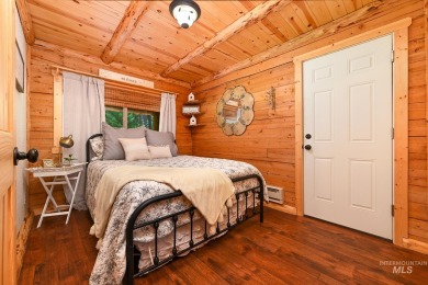 Introducing a one-of-a-kind hand-hewn log cabin nestled in the on Terrace Lakes Golf Resort in Idaho - for sale on GolfHomes.com, golf home, golf lot