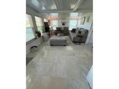 Imagine every day having coffee or lunch on your private deck on Hamptons Golf Club in Florida - for sale on GolfHomes.com, golf home, golf lot