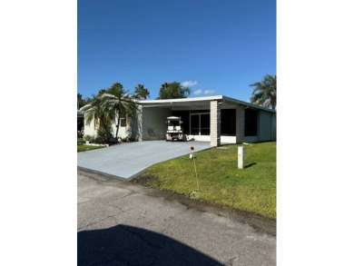 Imagine every day having coffee or lunch on your private deck on Hamptons Golf Club in Florida - for sale on GolfHomes.com, golf home, golf lot