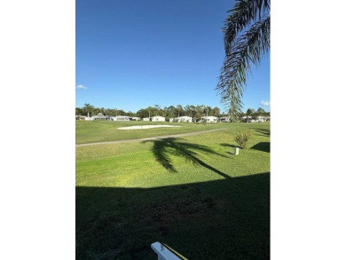 Imagine every day having coffee or lunch on your private deck on Hamptons Golf Club in Florida - for sale on GolfHomes.com, golf home, golf lot