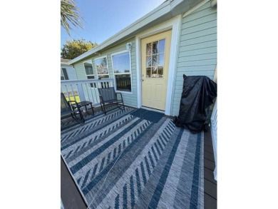 Imagine every day having coffee or lunch on your private deck on Hamptons Golf Club in Florida - for sale on GolfHomes.com, golf home, golf lot