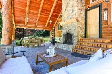 Introducing a one-of-a-kind hand-hewn log cabin nestled in the on Terrace Lakes Golf Resort in Idaho - for sale on GolfHomes.com, golf home, golf lot