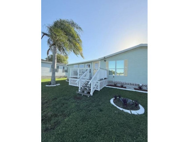 Imagine every day having coffee or lunch on your private deck on Hamptons Golf Club in Florida - for sale on GolfHomes.com, golf home, golf lot