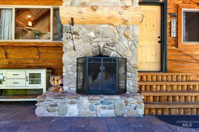 Introducing a one-of-a-kind hand-hewn log cabin nestled in the on Terrace Lakes Golf Resort in Idaho - for sale on GolfHomes.com, golf home, golf lot