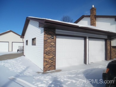 Charming 3-Bedroom, 2-Bath Bi-Level Home on the Golf Course! on Escanaba Country Club in Michigan - for sale on GolfHomes.com, golf home, golf lot