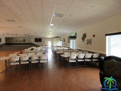 Imagine every day having coffee or lunch on your private deck on Hamptons Golf Club in Florida - for sale on GolfHomes.com, golf home, golf lot