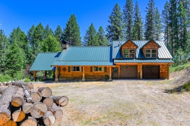 Introducing a one-of-a-kind hand-hewn log cabin nestled in the on Terrace Lakes Golf Resort in Idaho - for sale on GolfHomes.com, golf home, golf lot