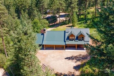 Introducing a one-of-a-kind hand-hewn log cabin nestled in the on Terrace Lakes Golf Resort in Idaho - for sale on GolfHomes.com, golf home, golf lot