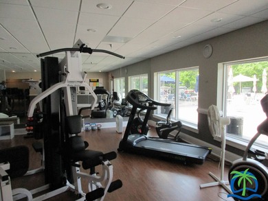 Imagine every day having coffee or lunch on your private deck on Hamptons Golf Club in Florida - for sale on GolfHomes.com, golf home, golf lot