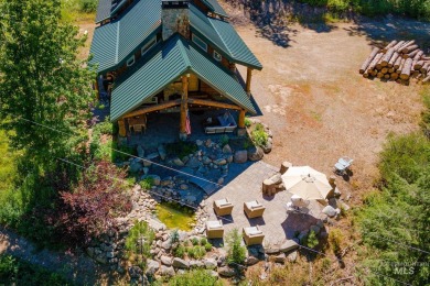 Introducing a one-of-a-kind hand-hewn log cabin nestled in the on Terrace Lakes Golf Resort in Idaho - for sale on GolfHomes.com, golf home, golf lot