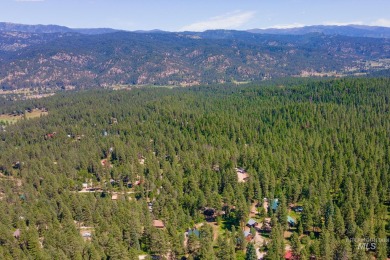 Introducing a one-of-a-kind hand-hewn log cabin nestled in the on Terrace Lakes Golf Resort in Idaho - for sale on GolfHomes.com, golf home, golf lot