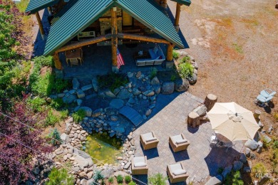 Introducing a one-of-a-kind hand-hewn log cabin nestled in the on Terrace Lakes Golf Resort in Idaho - for sale on GolfHomes.com, golf home, golf lot