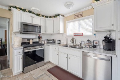 Welcome home to this charming 2-bedroom, 2-bath residence filled on Amsterdam Municipal Golf Course in New York - for sale on GolfHomes.com, golf home, golf lot