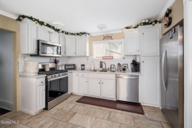 Welcome home to this charming 2-bedroom, 2-bath residence filled on Amsterdam Municipal Golf Course in New York - for sale on GolfHomes.com, golf home, golf lot