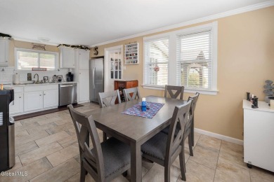 Welcome home to this charming 2-bedroom, 2-bath residence filled on Amsterdam Municipal Golf Course in New York - for sale on GolfHomes.com, golf home, golf lot