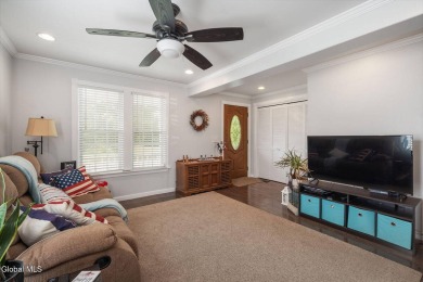 Welcome home to this charming 2-bedroom, 2-bath residence filled on Amsterdam Municipal Golf Course in New York - for sale on GolfHomes.com, golf home, golf lot