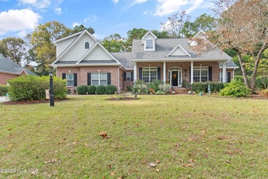 This beautiful home is nestled on a completely landscaped wooded on Lockwood Folly Country Club in North Carolina - for sale on GolfHomes.com, golf home, golf lot