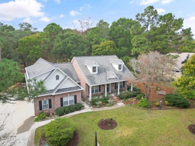 This beautiful home is nestled on a completely landscaped wooded on Lockwood Folly Country Club in North Carolina - for sale on GolfHomes.com, golf home, golf lot