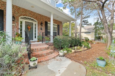 This beautiful home is nestled on a completely landscaped wooded on Lockwood Folly Country Club in North Carolina - for sale on GolfHomes.com, golf home, golf lot