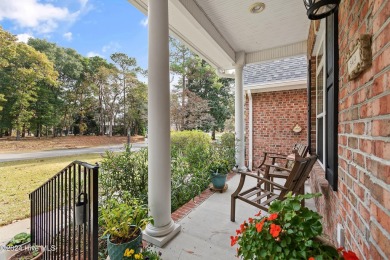 This beautiful home is nestled on a completely landscaped wooded on Lockwood Folly Country Club in North Carolina - for sale on GolfHomes.com, golf home, golf lot