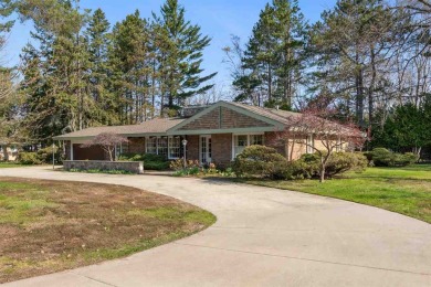 Mid-century modern classic, designed by renowned Charlevoix on Charlevoix Golf Club in Michigan - for sale on GolfHomes.com, golf home, golf lot