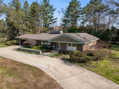 Mid-century modern classic, designed by renowned Charlevoix on Charlevoix Golf Club in Michigan - for sale on GolfHomes.com, golf home, golf lot