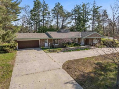Mid-century modern classic, designed by renowned Charlevoix on Charlevoix Golf Club in Michigan - for sale on GolfHomes.com, golf home, golf lot