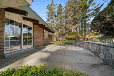 Mid-century modern classic, designed by renowned Charlevoix on Charlevoix Golf Club in Michigan - for sale on GolfHomes.com, golf home, golf lot
