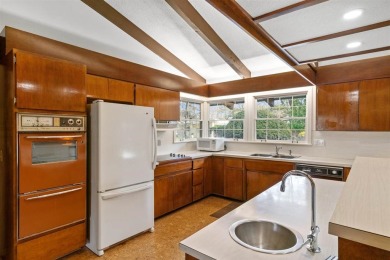 Mid-century modern classic, designed by renowned Charlevoix on Charlevoix Golf Club in Michigan - for sale on GolfHomes.com, golf home, golf lot