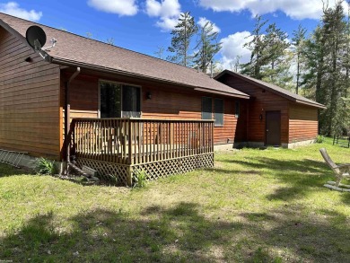 Charming 2 bedroom, 2 bath, 1,120 sq ft ranch home nestled on 3 on Garland Resort and Golf Club  in Michigan - for sale on GolfHomes.com, golf home, golf lot
