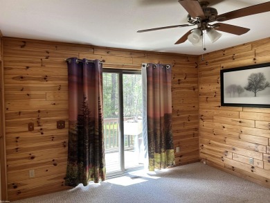 Charming 2 bedroom, 2 bath, 1,120 sq ft ranch home nestled on 3 on Garland Resort and Golf Club  in Michigan - for sale on GolfHomes.com, golf home, golf lot