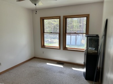 Charming 2 bedroom, 2 bath, 1,120 sq ft ranch home nestled on 3 on Garland Resort and Golf Club  in Michigan - for sale on GolfHomes.com, golf home, golf lot