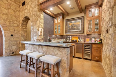 Nestled within the highly exclusive Escondido Golf & Lake Club on Escondido Golf and Lake Club  in Texas - for sale on GolfHomes.com, golf home, golf lot