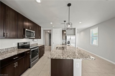 Entertain guests with ease in the open kitchen, dining, and on Babcock National Golf Course in Florida - for sale on GolfHomes.com, golf home, golf lot