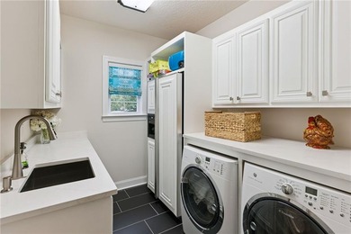 THIS IS A BEAUTIFULLY UPDATED, LUXURIOUS HOME IN PRESTIGIOUS OAK on Oak Grove Island Golf and Country Club in Georgia - for sale on GolfHomes.com, golf home, golf lot