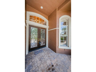 Welcome to this beautifully appointed 5-bedroom, 4-bathroom on Wentworth Golf Club in Florida - for sale on GolfHomes.com, golf home, golf lot
